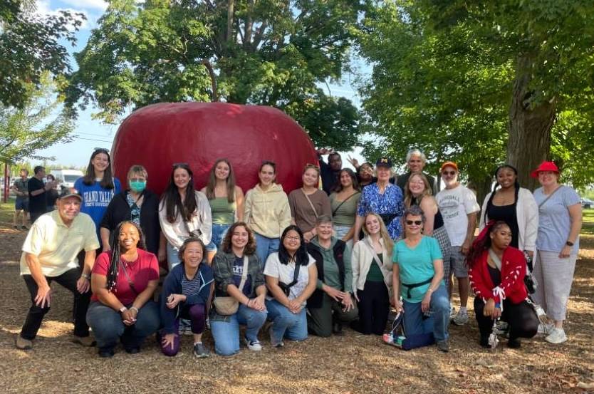 Picture of group having fun at Fall 2025 apple picking event